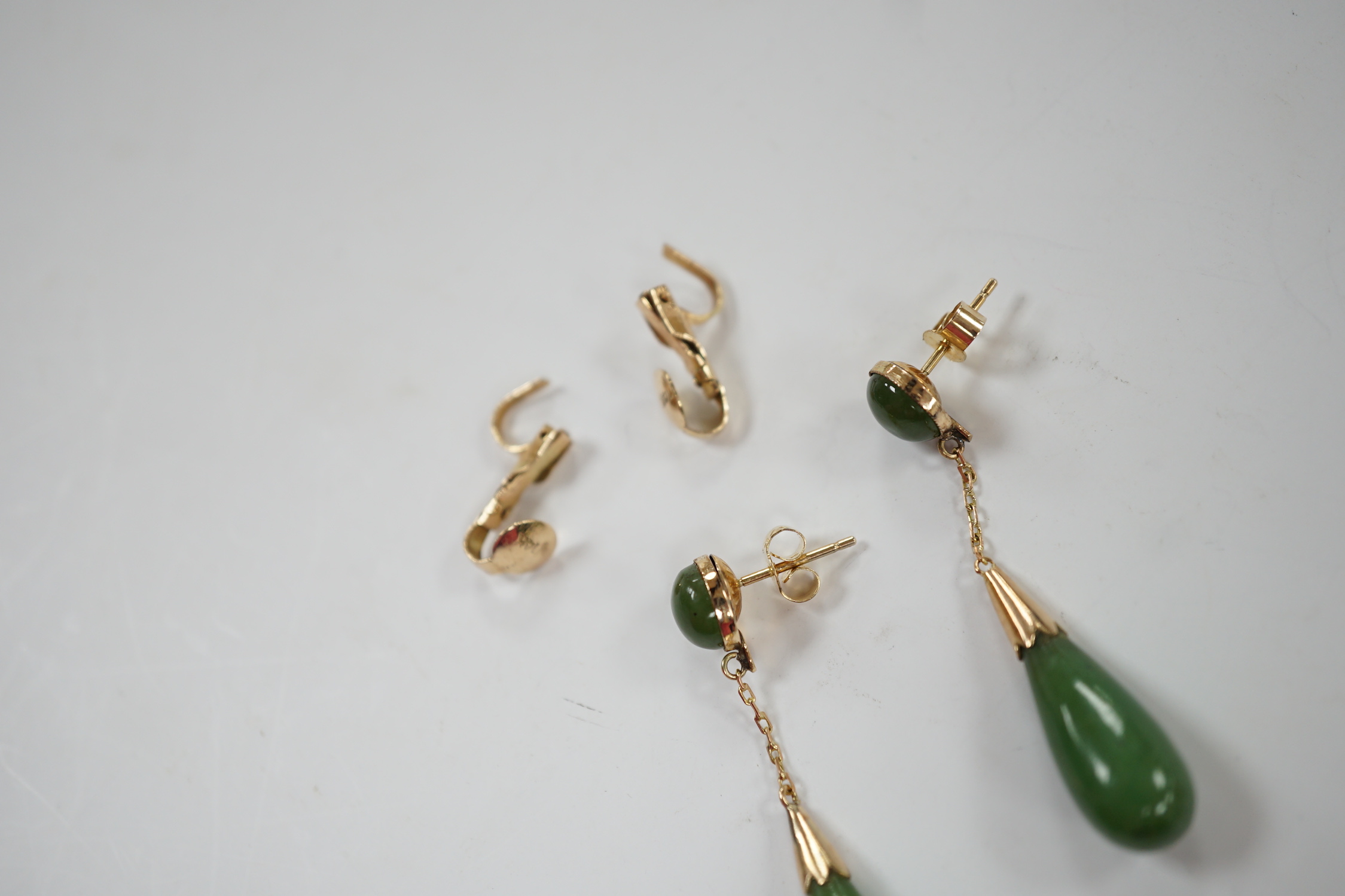 A pair of 375 and two stone jade set drop earrings, 44mm, with a pair of 14k fittings.